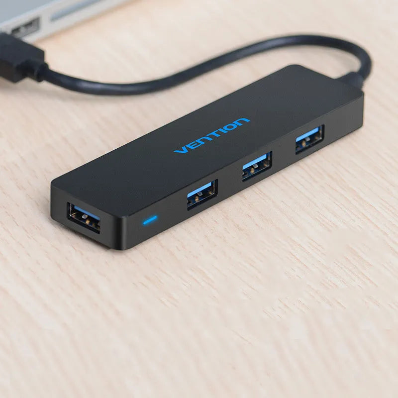Black USB 3.0 four-port hub with short cable and nickel-plated connectors