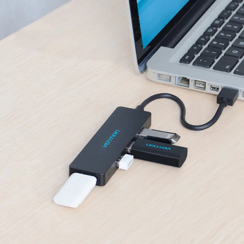 Black USB 3.0 four-port hub with short cable and nickel-plated connectors