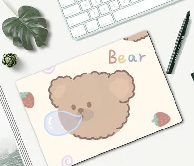 Cute cartoon character mouse pad with wrist support, measuring 260mm by 210mm, on a desk.
