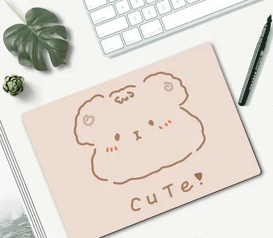 Cute cartoon character mouse pad with wrist support, measuring 260mm by 210mm, on a desk.