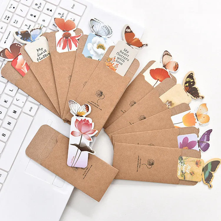 Butterfly-shaped paper bookmark with random colour design for gifting and stationery use.