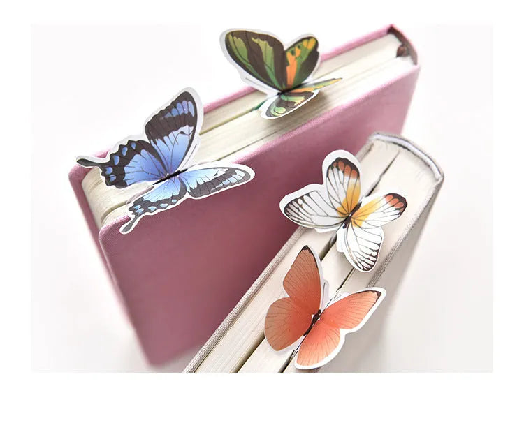 Butterfly-shaped paper bookmark with random colour design for gifting and stationery use.