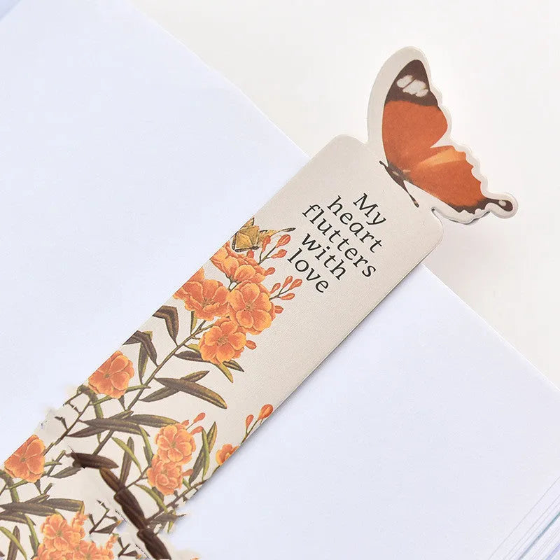 Butterfly-shaped paper bookmark with random colour design for gifting and stationery use.