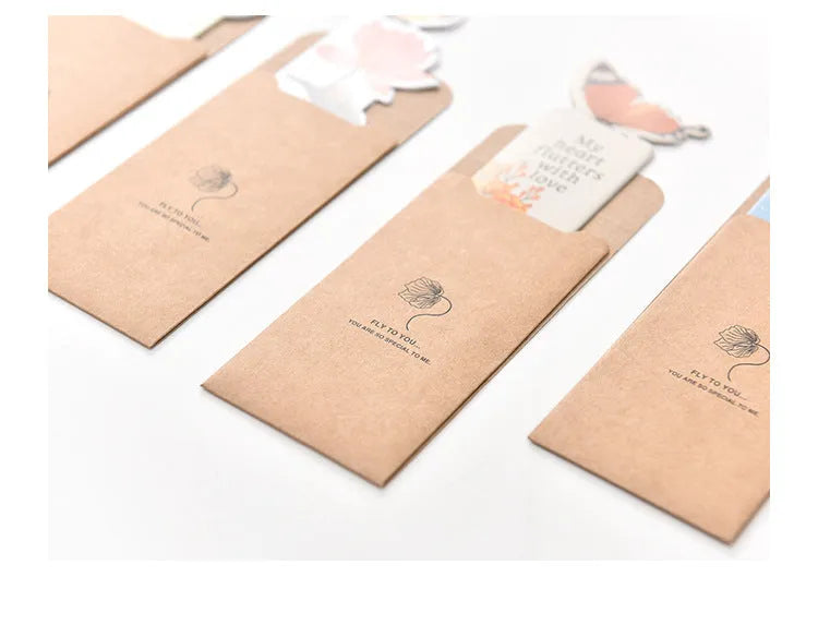 Butterfly-shaped paper bookmark with random colour design for gifting and stationery use.