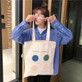 Women's geometric pattern canvas tote shopper bag with zipper closure in orange colour.