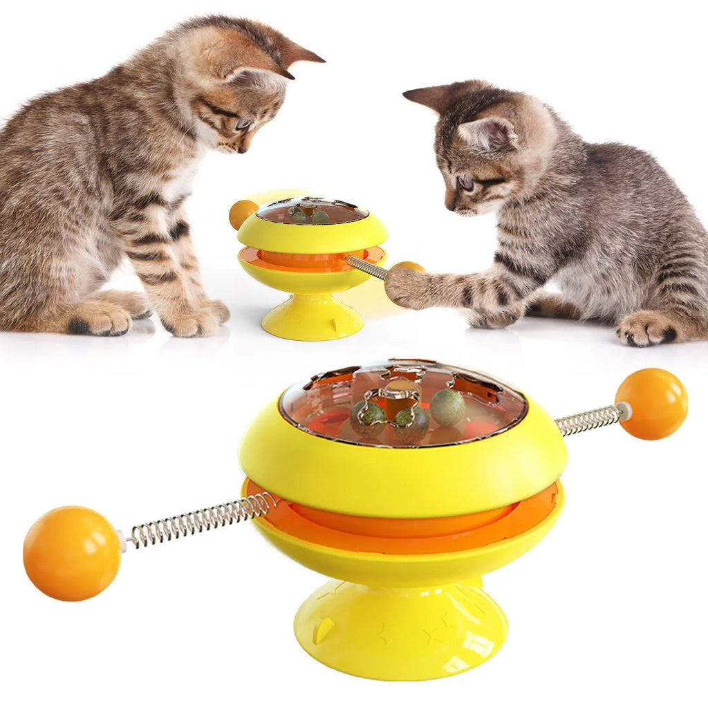 Rotatable cat toy with suction cup base and transparent dome containing catnip balls, in a choice of colours.