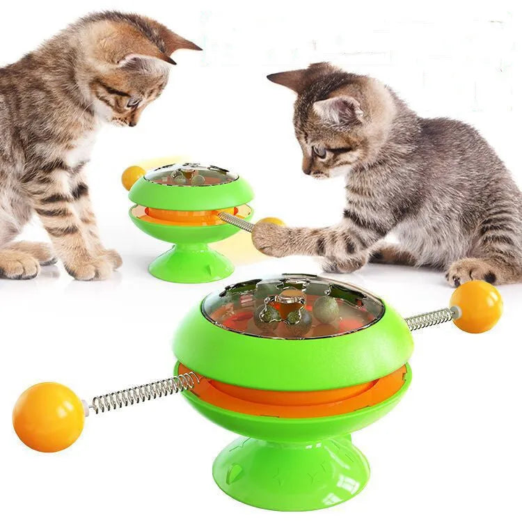 Rotatable cat toy with suction cup base and transparent dome containing catnip balls, in a choice of colours.