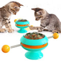 Rotatable cat toy with suction cup base and transparent dome containing catnip balls, in a choice of colours.
