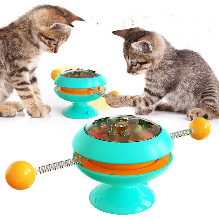 Rotatable cat toy with suction cup base and transparent dome containing catnip balls, in a choice of colours.