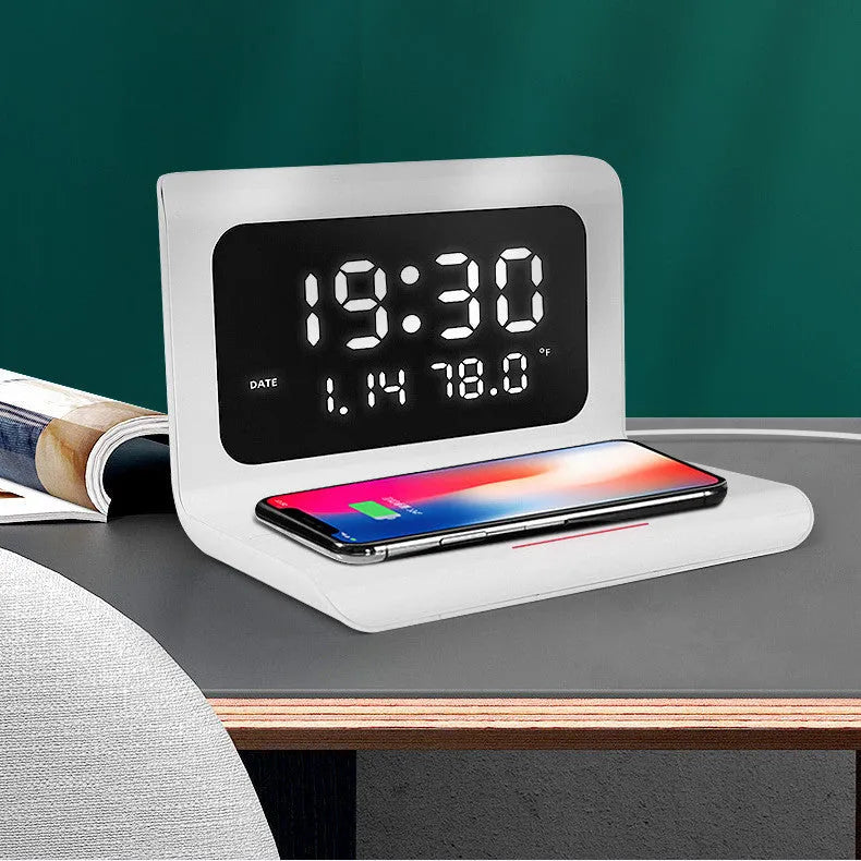 White wireless charger alarm clock displaying time, calendar, temperature and humidity with 10W charging capability