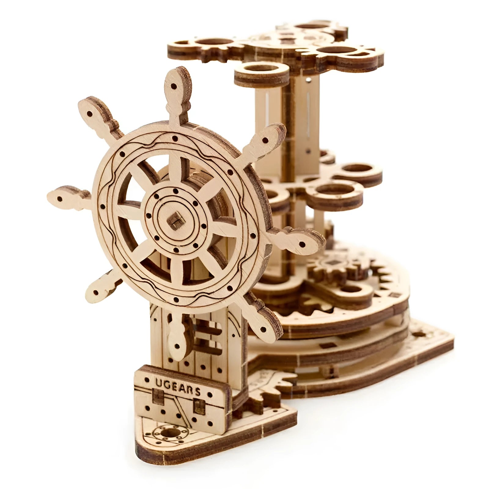Wooden model of Ukrainian machinery with a steering wheel that rotates a central pen holder on a desk.