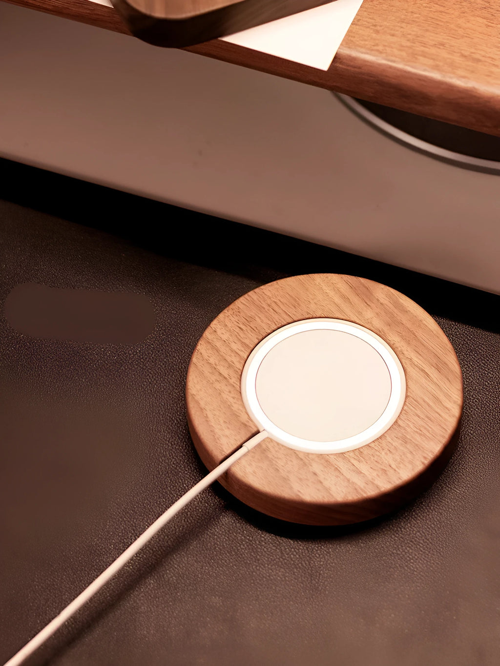 Walnut wood MagSafe wireless charging bracket stand for iPhone on a desk