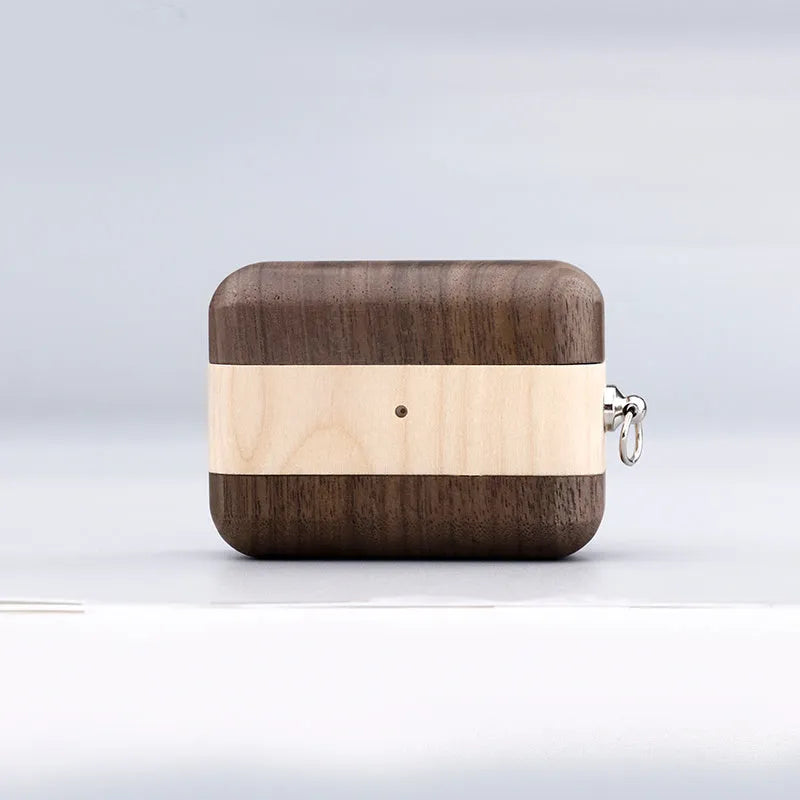 Hardwood Bluetooth earphone sleeve in a choice of wood types next to wireless earphones.