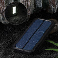 Orange three-proof solar power bank showing solar panel and USB ports