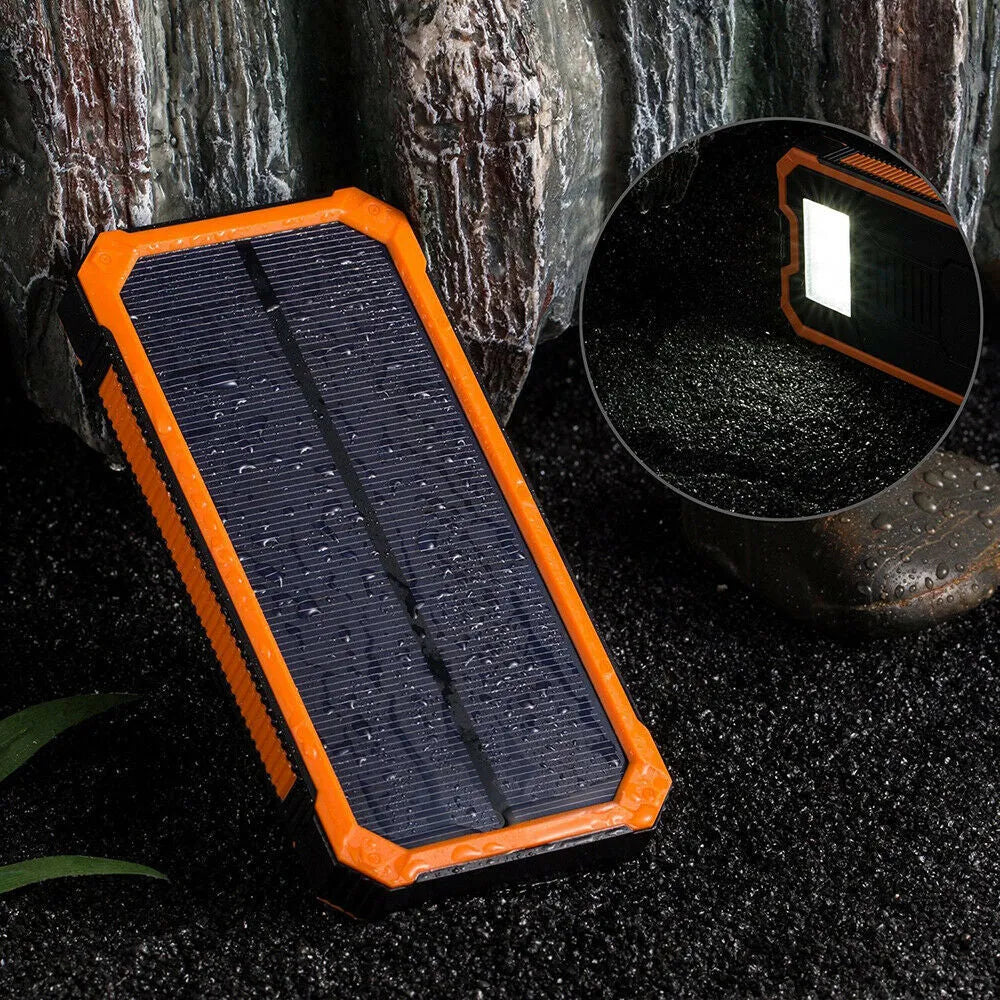 Orange three-proof solar power bank showing solar panel and USB ports