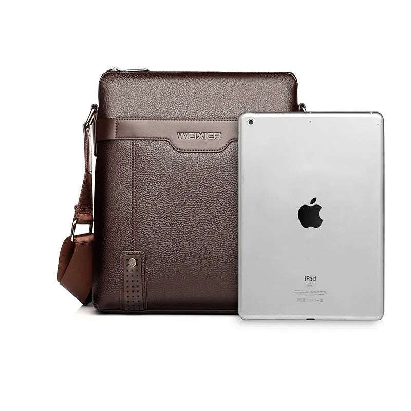 Medium square vertical PU leather shoulder bag in black with single strap and zipper closure