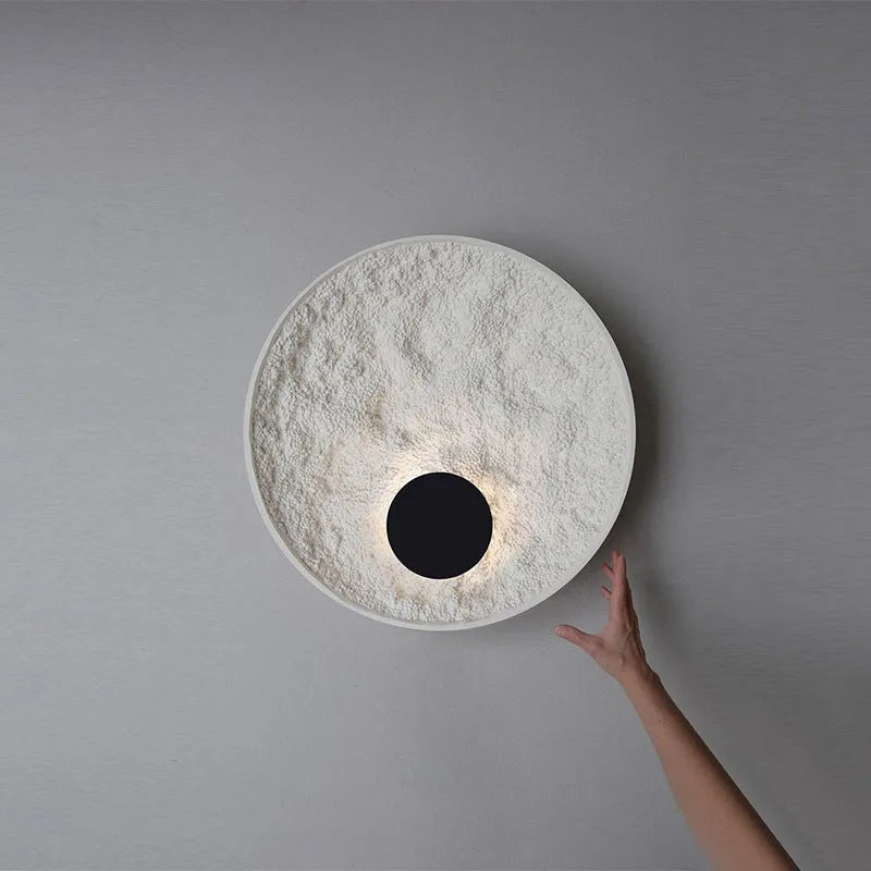 Modern round white iron wall lamp shown in two size options.