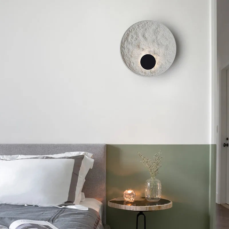 Modern round white iron wall lamp shown in two size options.