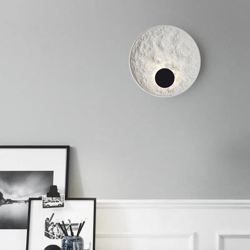Modern round white iron wall lamp shown in two size options.