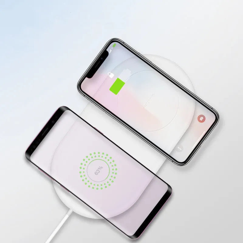 White dual wireless charging station for two mobile phones with fast charging support