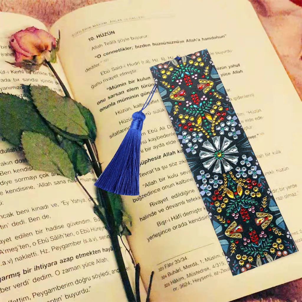 Leather bookmark with applied special-shaped diamonds forming a geometric mandala flower design.
