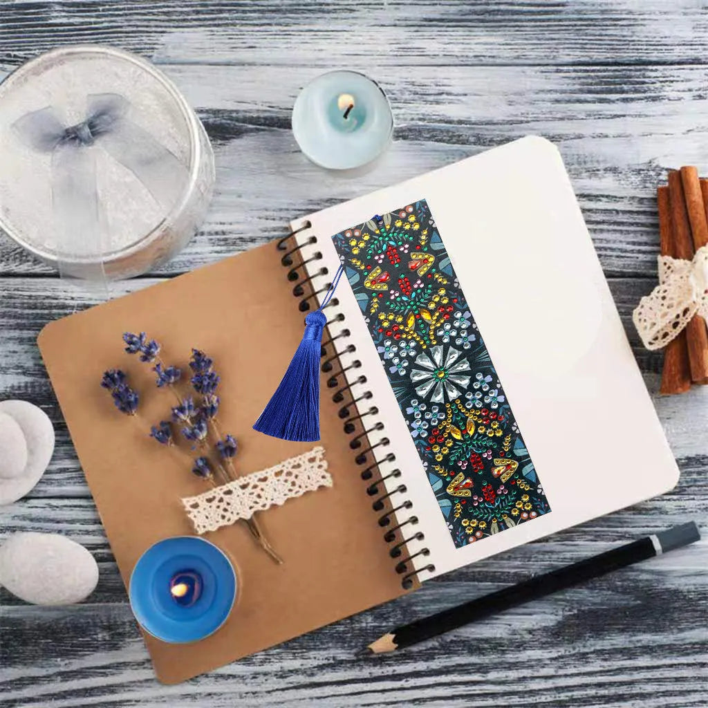 Leather bookmark with applied special-shaped diamonds forming a geometric mandala flower design.