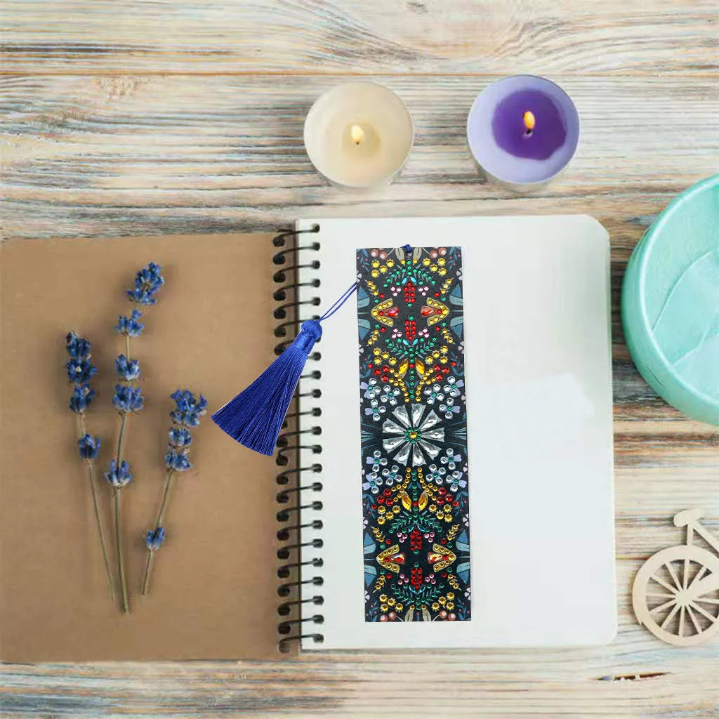 Leather bookmark with applied special-shaped diamonds forming a geometric mandala flower design.