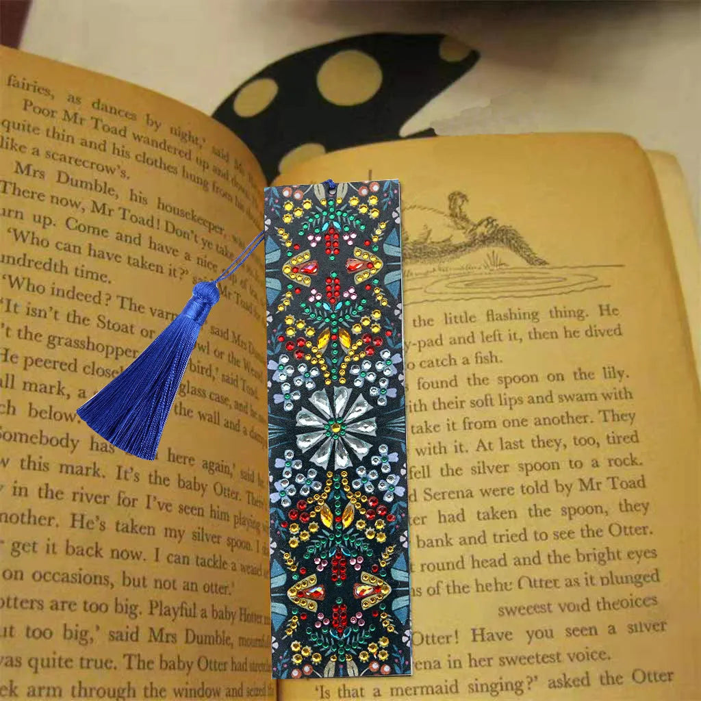 Leather bookmark with applied special-shaped diamonds forming a geometric mandala flower design.