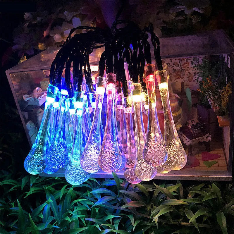 Solar-powered outdoor LED string lights with water drop pendants on 6.5 metre cable
