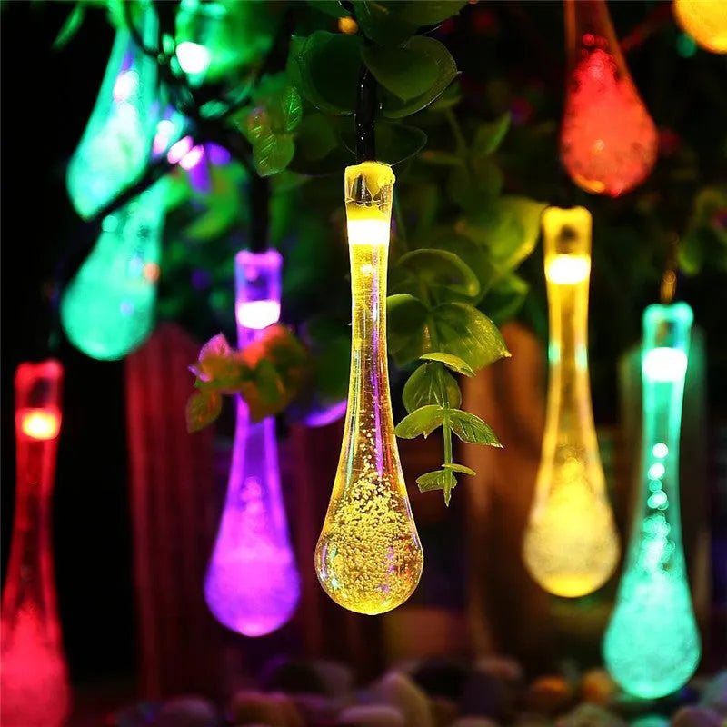 Solar-powered outdoor LED string lights with water drop pendants on 6.5 metre cable