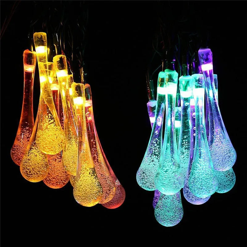 Solar-powered outdoor LED string lights with water drop pendants on 6.5 metre cable