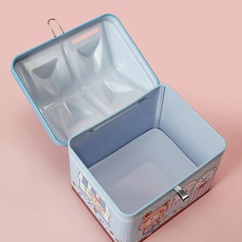 Blue house-shaped tinplate piggy bank with coin slot on roof