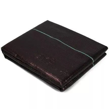 Black plastic weed-proof cloth laid on farmland soil for weed suppression