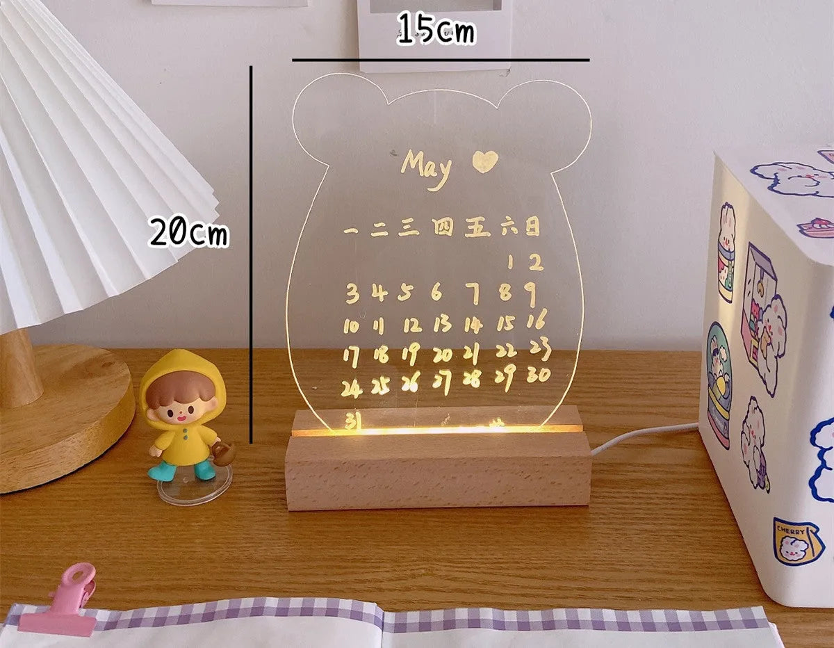 LED bedside night light with an optional erasable message board on a nightstand.