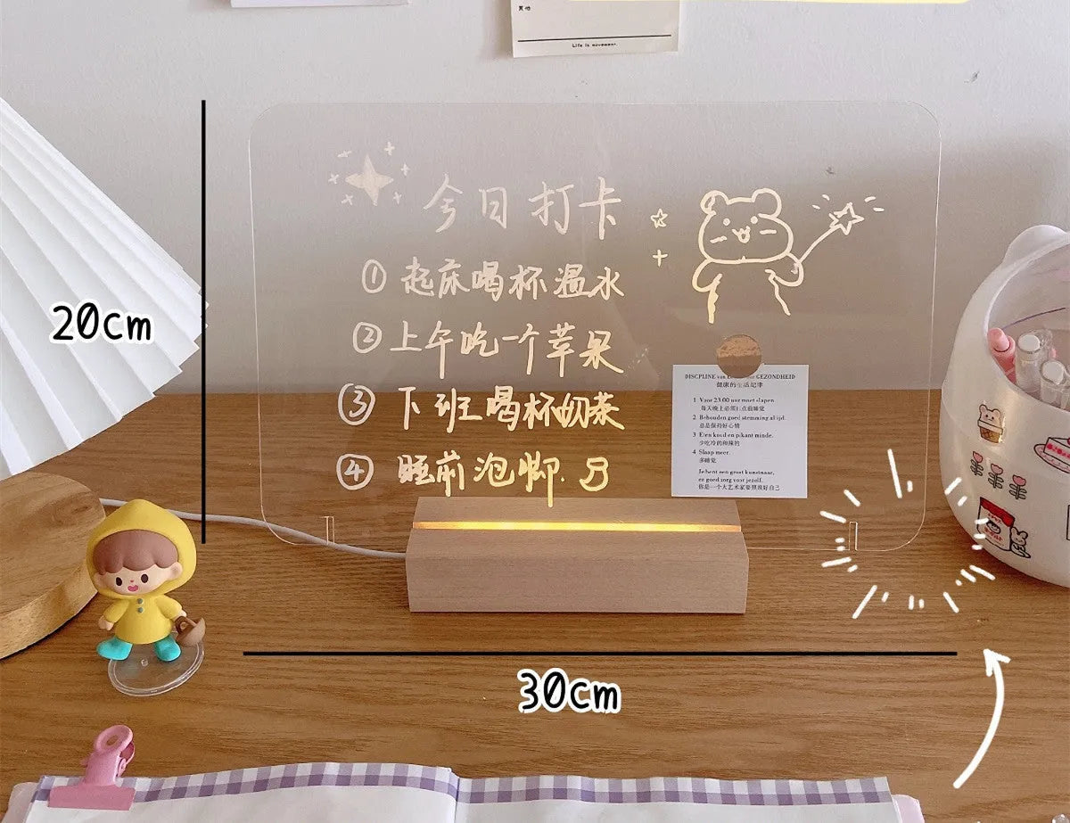 LED bedside night light with an optional erasable message board on a nightstand.
