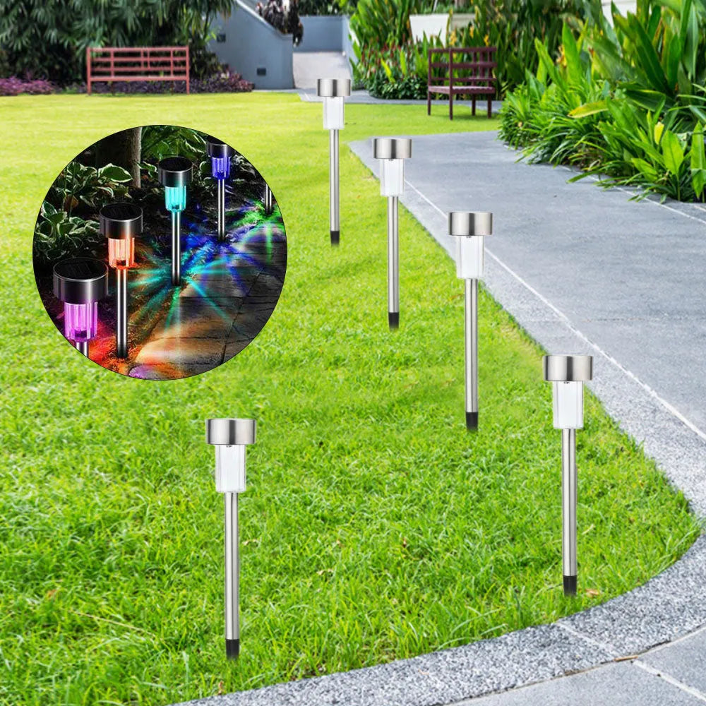 Stainless steel pastoral-style garden LED light placed outdoors on grass.