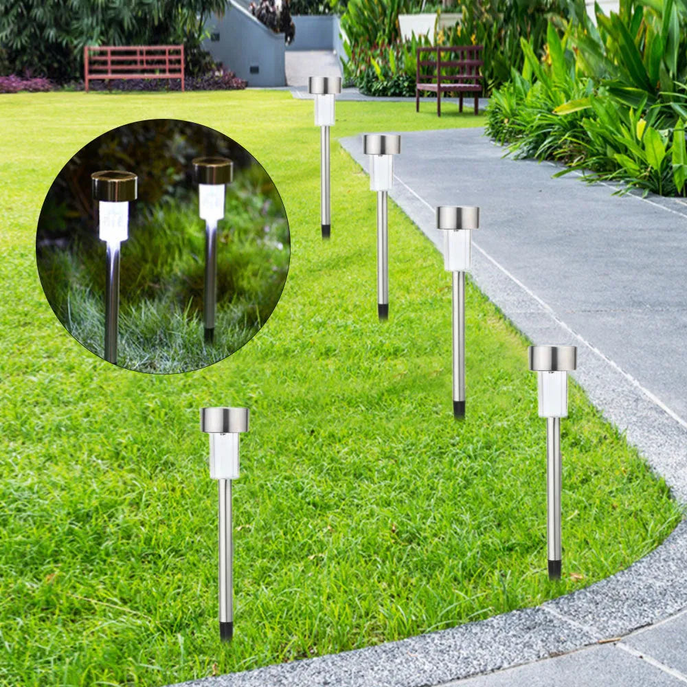 Stainless steel pastoral-style garden LED light placed outdoors on grass.