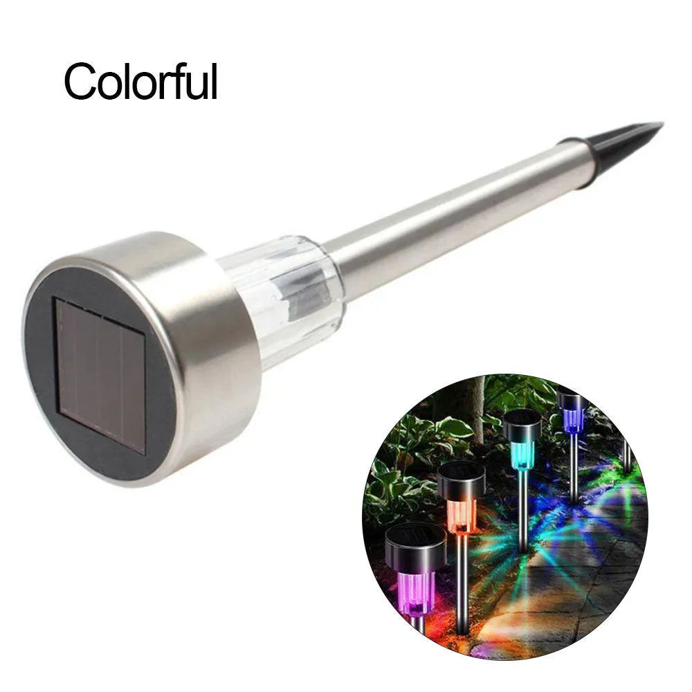 Stainless steel pastoral-style garden LED light placed outdoors on grass.