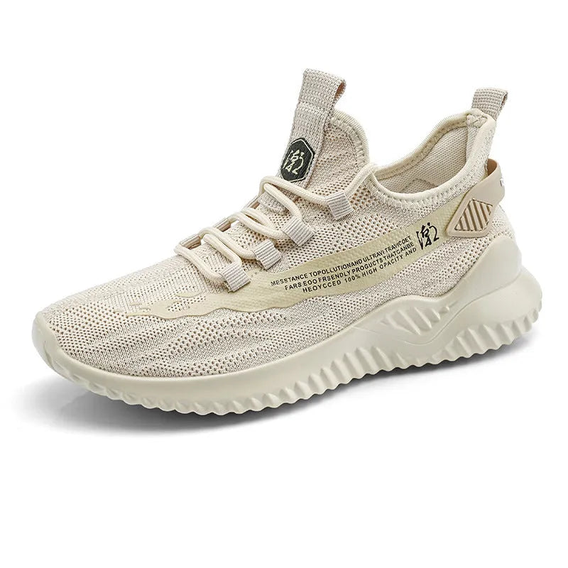 Men's white low-top sports shoes with mesh upper and rubber sole on neutral background