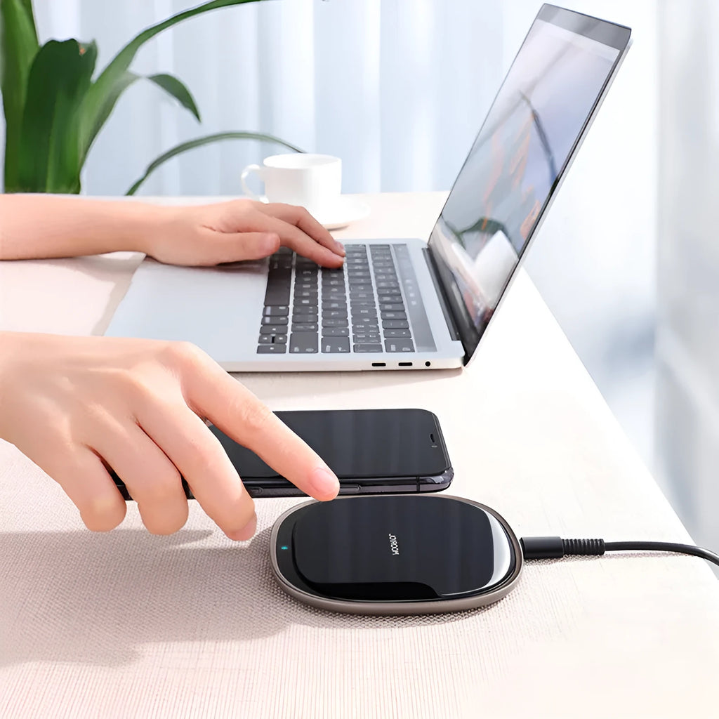 Square black or white 15W wireless phone charger with a glass top and zinc alloy body.