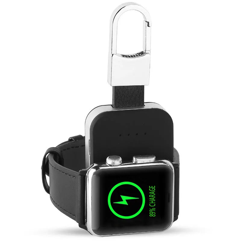 Black Apple Watch portable wireless power bank on a keyring showing compact size