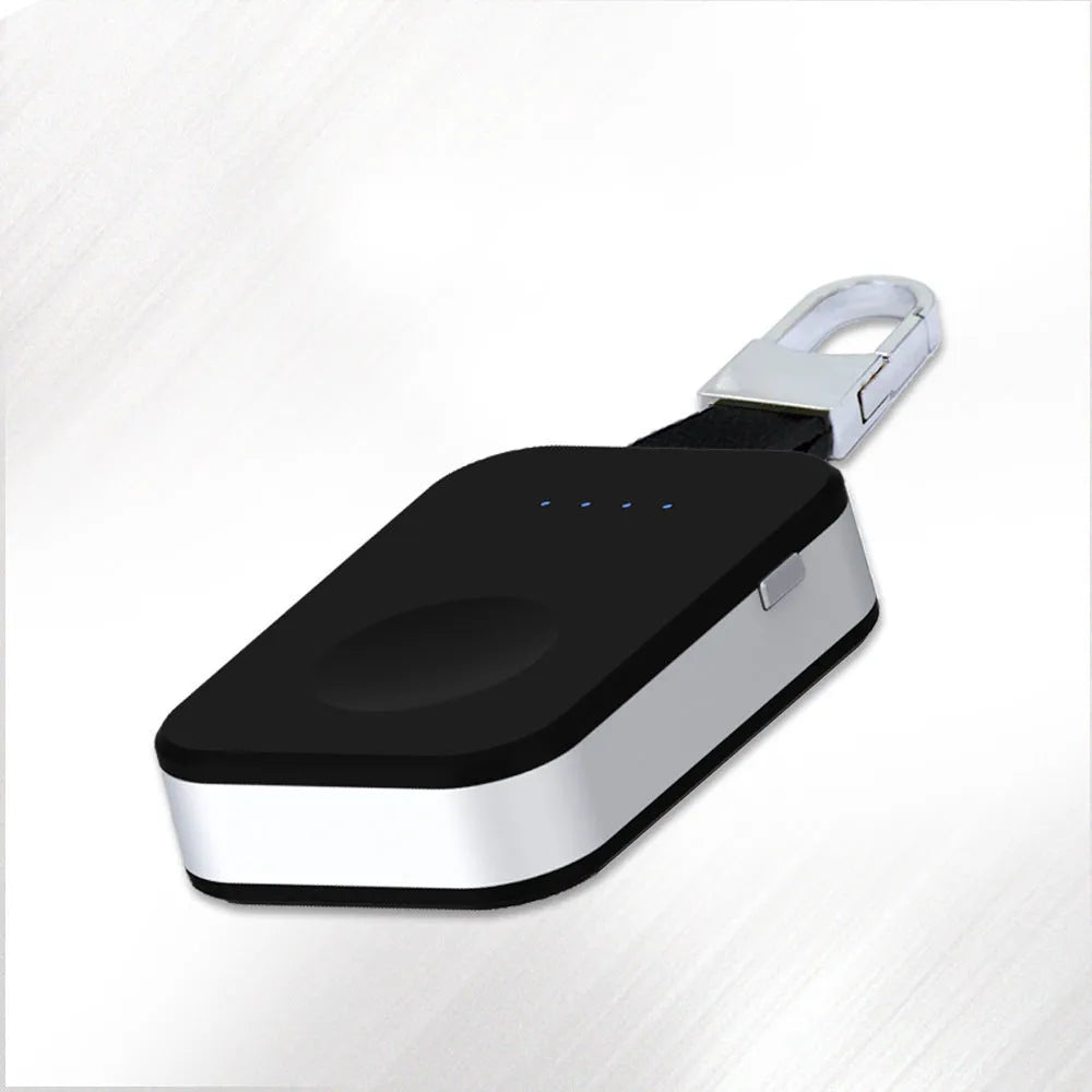 Black Apple Watch portable wireless power bank on a keyring showing compact size