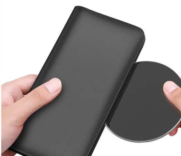 Ultra-thin aluminium wireless charger in metallic finish showing micro USB port