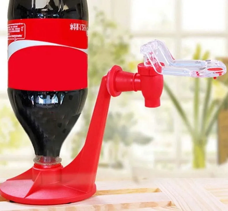 Red plastic Magic Tap soda dispenser attached to inverted 2-litre bottle