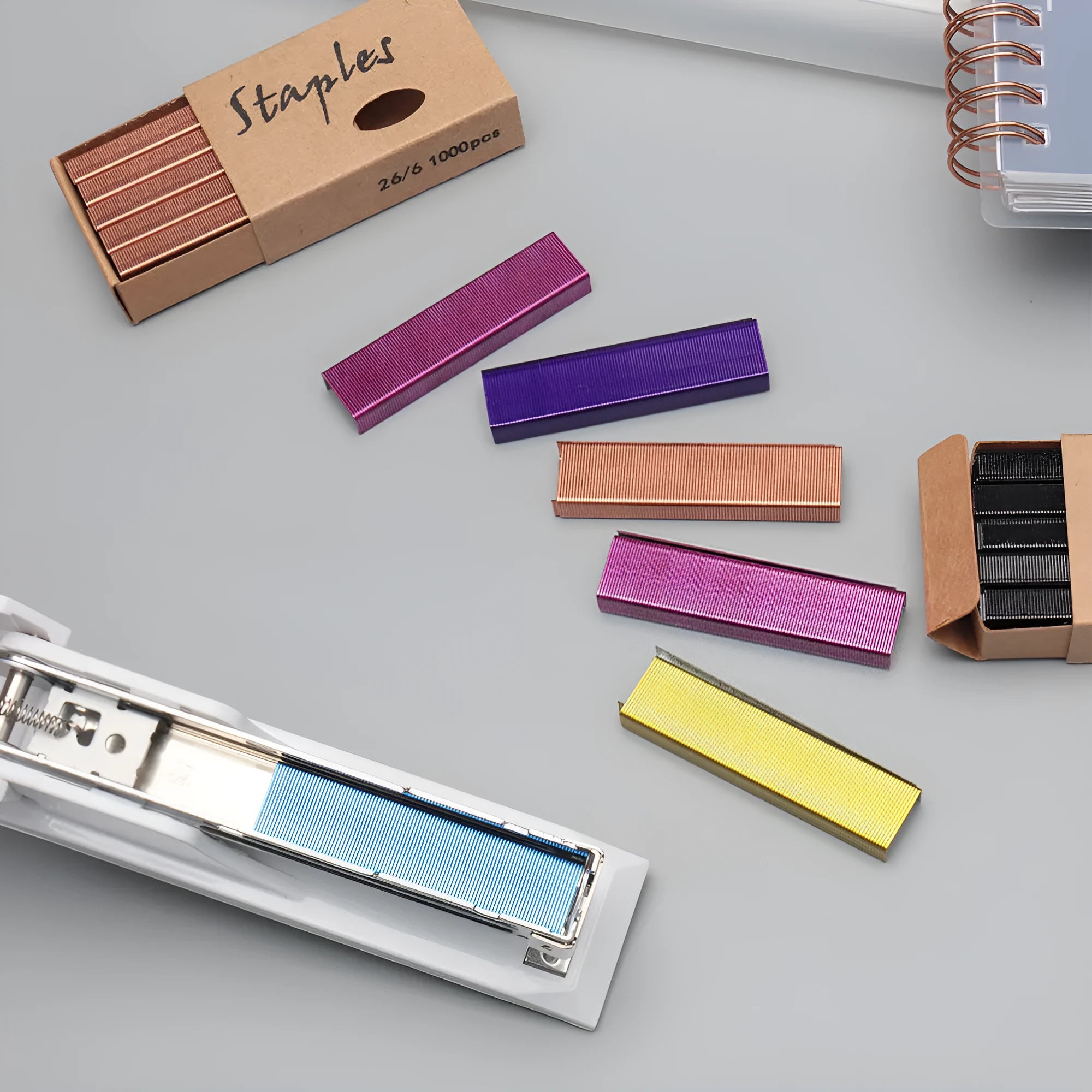 Box of 1000 metal stitching staples in a choice of black, purple, rose gold, or rose red.