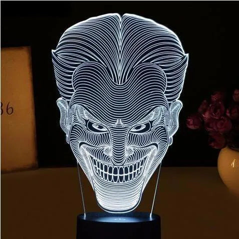 3D acrylic LED lamp showing colourful illumination on a square base, with remote control and USB cable
