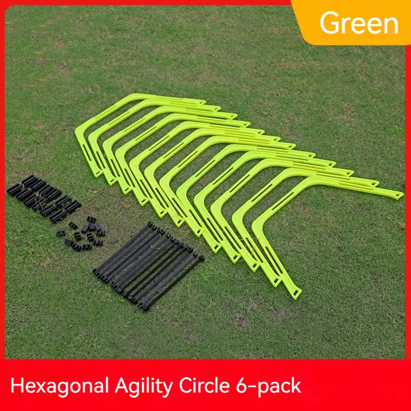 Set of six foldable yellow green and orange hexagon football agility training rings on grass