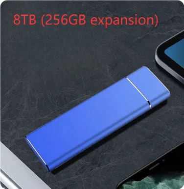 Sapphire blue metal external solid state hard disk with USB cable on a white surface