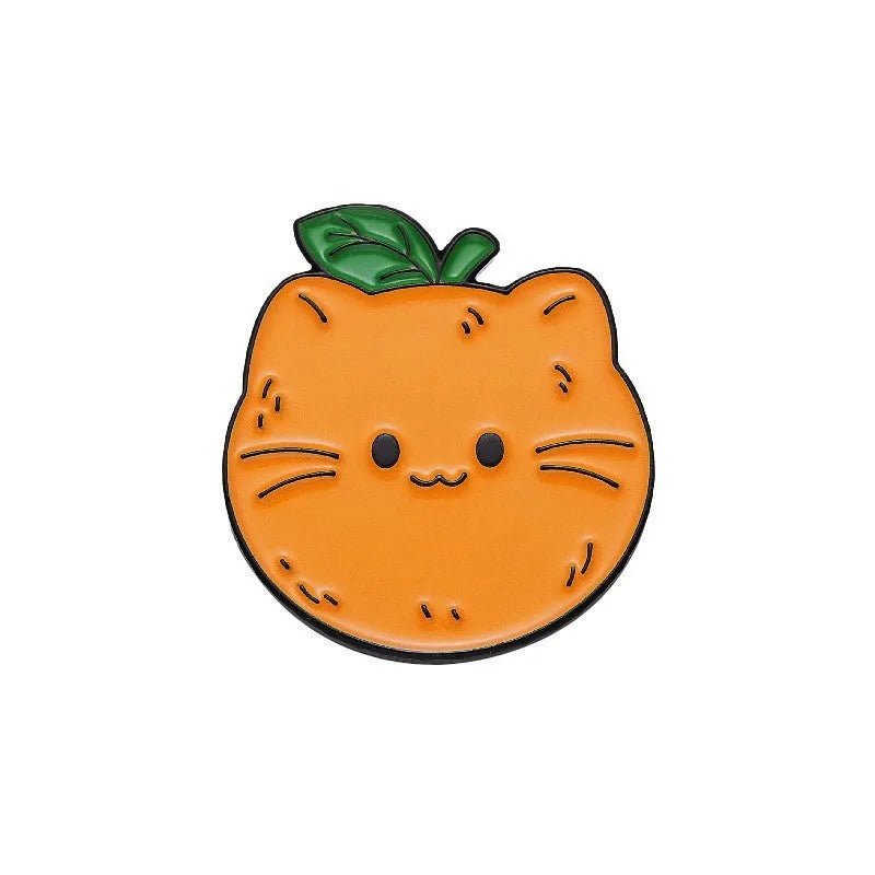 Colourful cartoon fruit design zinc alloy brooch pin on a fabric background.
