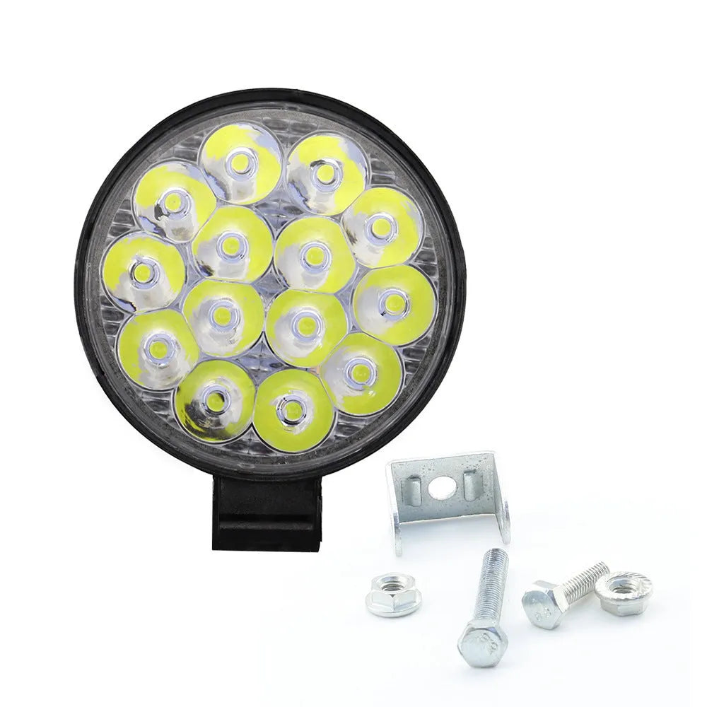White aluminium LED work light unit with IP67 waterproof rating, suitable for car and off-road vehicle mounting.